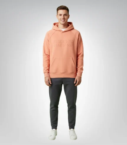 Stylish coral hoodie from Fear of God Essentials collection