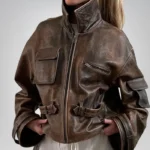 Vintage brown distressed leather jacket for women – cropped bomber coat with buckles