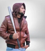 Side view of men’s tan hooded bomber jacket highlighting premium lambskin texture and fit