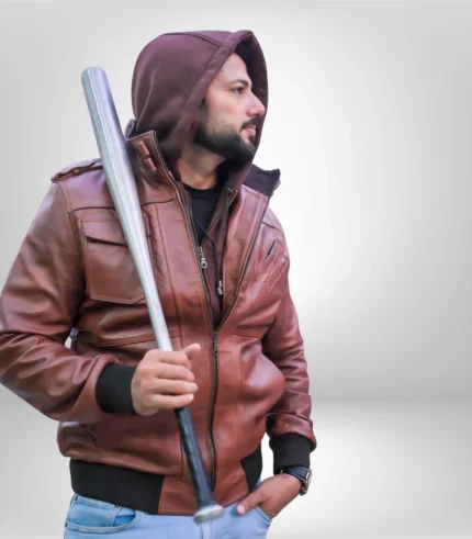 Side view of men’s tan hooded bomber jacket highlighting premium lambskin texture and fit