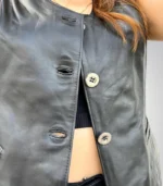 Trendy women’s biker-style black leather vest made from genuine leather