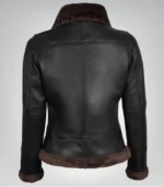 Alt Text: Cozy dark brown leather bomber jacket with shearling lining for women