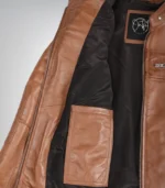 Stylish women’s tan leather moto jacket featuring classic biker details