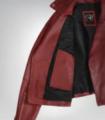 Women’s black leather biker jacket featuring belted waist